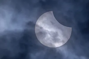 Solar Eclipse Germany Prints: Partial solar eclipse with clouds in the sky