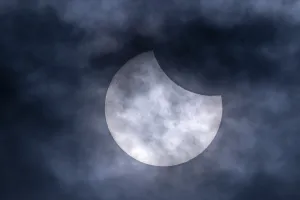 Solar Eclipse Germany Prints: Partial solar eclipse with clouds in the sky