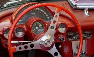 Uninhabited Countryside Europe Prints: Red steering wheel with dashboard