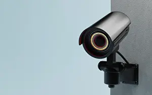 CCTV Security Camera Prints: CCTV Security camera isolated on wall at blue background