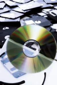 Data Storage Solutions Prints: A CD, floppy disk in background