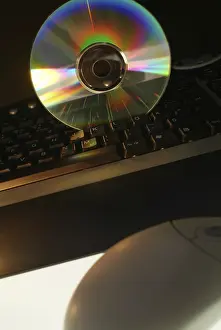 Digital Data Storage Device Prints: Cd rome on computer keyboard