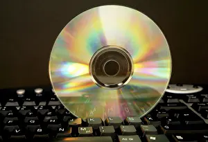 Digital Data Storage Device Prints: Cd rome on computer keyboard