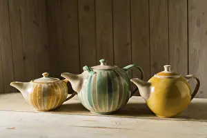 Pottery Making Process Prints: Ceramic workshop, three glazed pots on workbench
