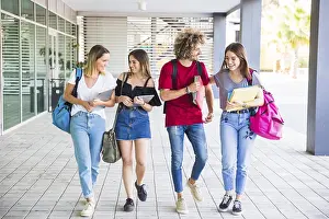 Female Student Portrait Prints: Cheerful students communicating after lessons