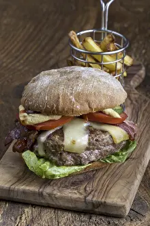 Unhealthy Snack Options Prints: Cheeseburger with chips on wood