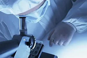 Microscope Examination Prints: Chemist looking through a microscope