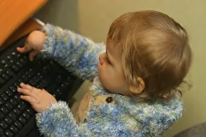 One Person Studying Prints: Child checkin out a computer