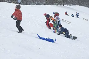 Winter Sledging Prints: Three children are pulling their sledge up the hill