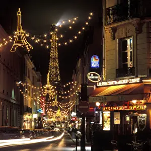 Christmasy Atmosphere In Europe Prints: Christmas lights with the Eiffel Tower in the background