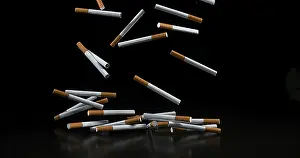 Addictive Drug Symbolism Prints: Cigarettes Falling against Black Background