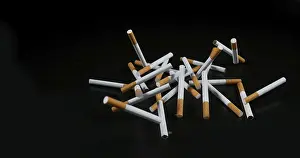 Black Background Studio Shot Prints: Cigarettes Falling against Black Background