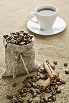 White Tableware Prints: Cinnamon and cup of coffee on sacking