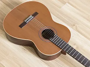 Plucked String Instrument Prints: A classical guitar with six nylon strings