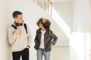 Classmates walking in corridor