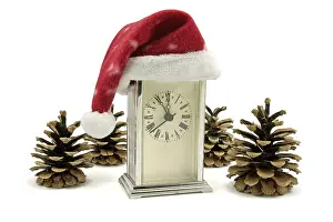 Deserted Clock Tower Prints: Clock with Santa hat and pine cones over white