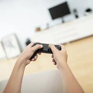 Young Gamer Prints: Close up boy holding game controller