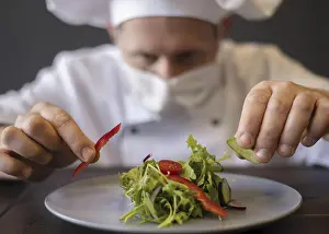 Face Mask Protection Prints: Close up chef with mask preparing dish