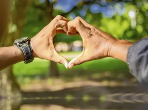 Close Up Heart Shape Prints: Close up of two hands together in a heart shape