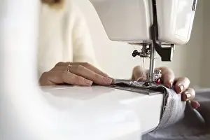 Handicraft Photography Prints: Close up person using sewing machine