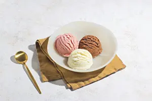 Close Up Desserts Prints: A close up of three scoops of vanilla