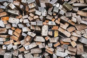 Deserted Woodpile Prints: Close up of a stack of timber with rusty nails