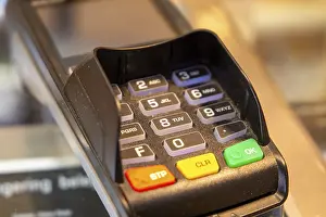 Cashless Payment Concept Prints: Close-up of a card reader