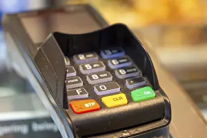 Cashless Payment Concept Prints: Close-up of a card reader