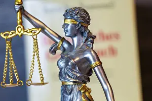 Weighing Scale Concept Prints: Close-up of a Justitia in front of the civil code