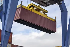 Deserted Harbor Scene Prints: Close-up of the loading of a shipping container