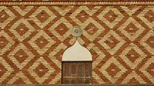 Brick Wall Design Prints: Close-up of a patterned brick wall with geometric design