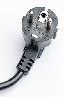 Studio Cutout Image Prints: Close-up of a Schuko plug on a white background