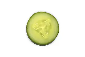 Bright Light Food Photography Prints: Close-up of a single cucumber slice