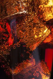High Calorie Food Images Prints: Close up view of the ice cubes in cola background
