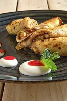 Homemade Crepes Recipe Prints: Close up view of thin pancakes with fruit stuffing