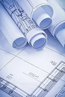 Rolled Up Documents Prints: Close up view stack of white construction blueprints