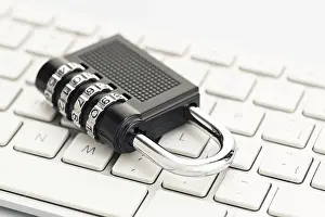 Images Dated 11th April 2024: Print of a Closed Padlock on a Computer Keyboard