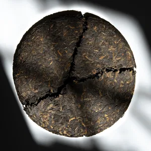 Close Up Food Photography Prints: A closeup view of a circular compressed tea cake