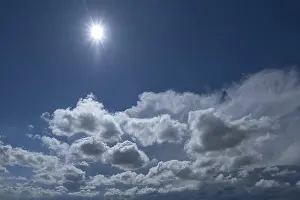 Cloudy Skies In Europe Prints: Cloud formations with sun against the light