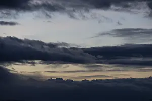 Deserted Evening Atmosphere Prints: Cloud hole at sunset, bizarre clouds