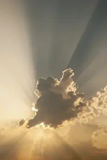 Western Europe Cloudy Skies Prints: Cloud in front of the sun showing rays of light