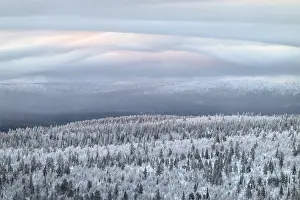 Overcast Sky In Europe Prints: Clouds over forested mountain ranges