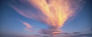 Overcast Evening Atmosphere Prints: Clouds glow orange in the evening light
