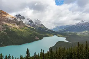 Tourist Attraction In Canada Prints: Clouds hanging in mountain peaks