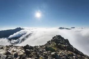 Deserted Alpine Scene Prints: Clouds passing over the mountain ridge