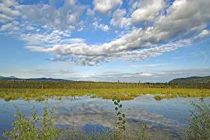 Cloudy Sky Over Lake Prints: Clouds reflected in a crystal clear
