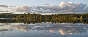 Atmospheric Light Scenery Prints: Clouds reflected on the water surface