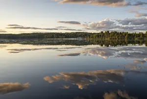 Cloudy Sky Over Lake Prints: Clouds reflected on the water surface