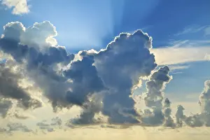 Red Morning Sky Prints: Clouds in sky with sunrays on sunrise