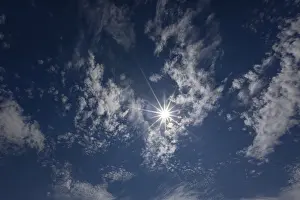 Altocumulus Clouds Prints: Cloudy sky with altocumulus clouds and sun rays
